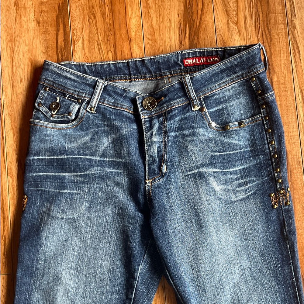 Women’s studded dark wash distressed mid rise straight leg jeans